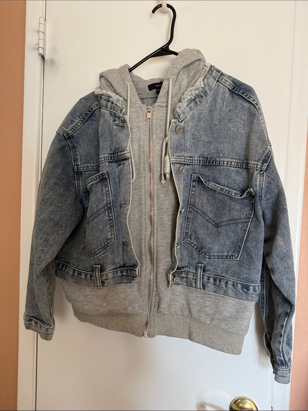 Women’s denim jacket with grey sweatshirt lining